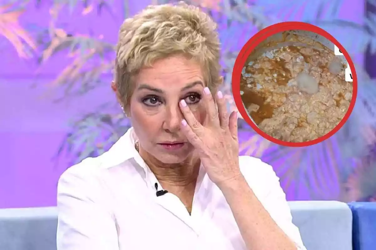 Una persona con cabello corto y rubio se toca el ojo mientras está sentada en un set de televisión con fondo morado, y hay un círculo rojo que muestra una imagen de comida o sustancia en mal estado.